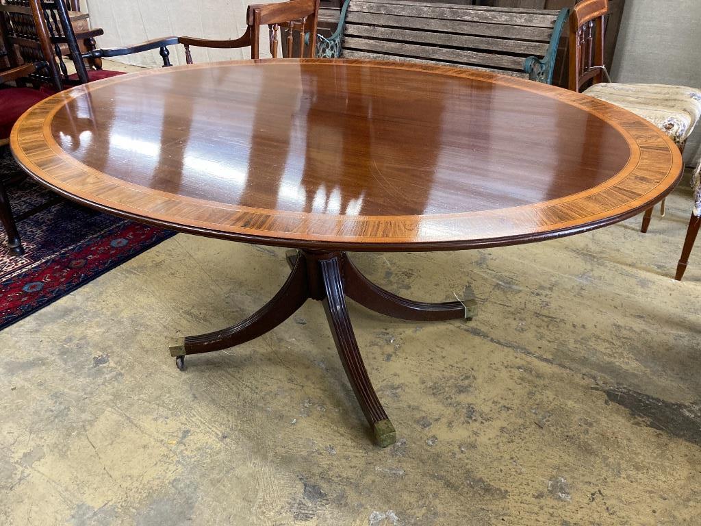 A George III style rosewood banded mahogany oval breakfast table, length 170cm, width 120cm, height 73cm